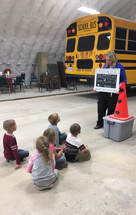 group of students learning about the bus