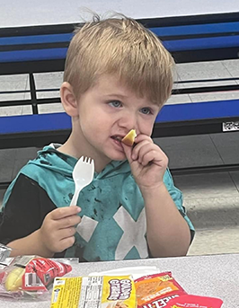 Student showing food items