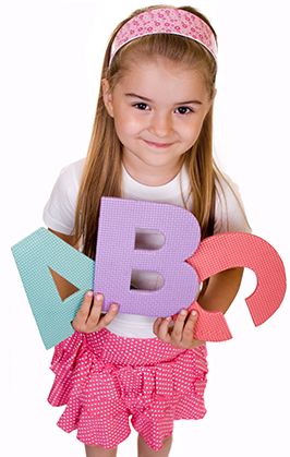 Female student holds ABC letters