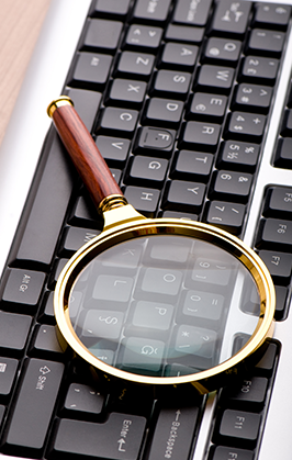 Magnifying glass on a keyboard